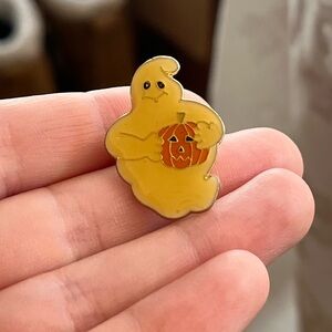 Enamel Ghost Lapel Pin holding Pumpkin